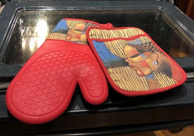 Composite Of A Woman Oven Mitt and Potholder Set