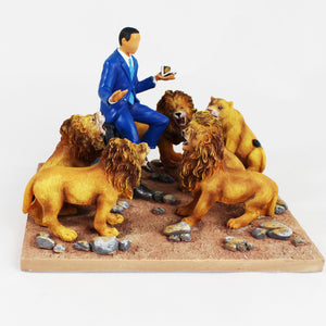 President Obama In The Lion's Den figurine. President sitting on a stump surrounded by six fierce lions - front