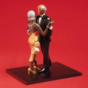 A Scene from RSVP Figurine by Annie Lee couple in fancy dress dancing front on red backdrop