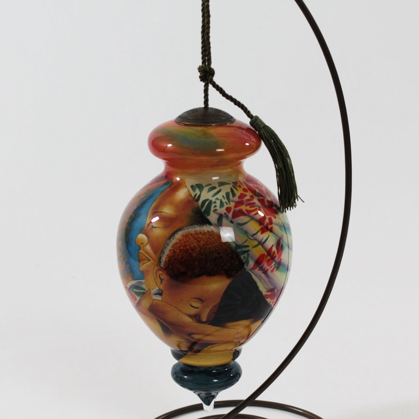 In Mothers Hands NeQwa Art Glass Ornament art by Keith Mallett hanging