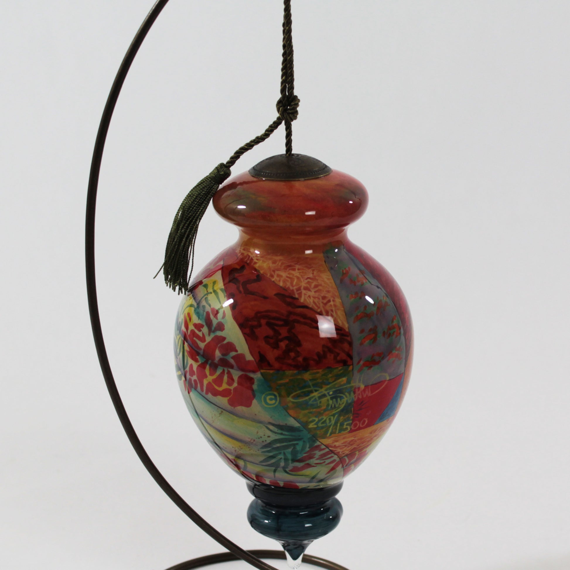 In Mothers Hands NeQwa Art Glass Ornament art by Keith Mallett back