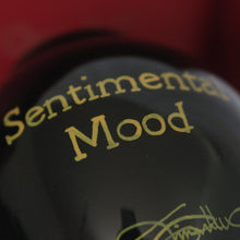 Load image into Gallery viewer, ne&#39;qwa ornament rear design gold text reads &quot;Sentimental Mood&quot;  on black glass
