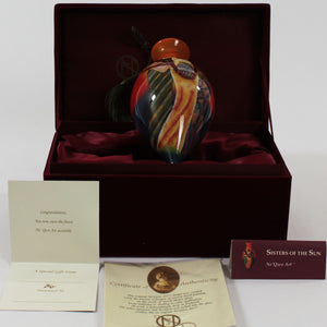 Sisters of the Sun Ne'Qwa Art Glass Ornament by Keith Mallett packaging
